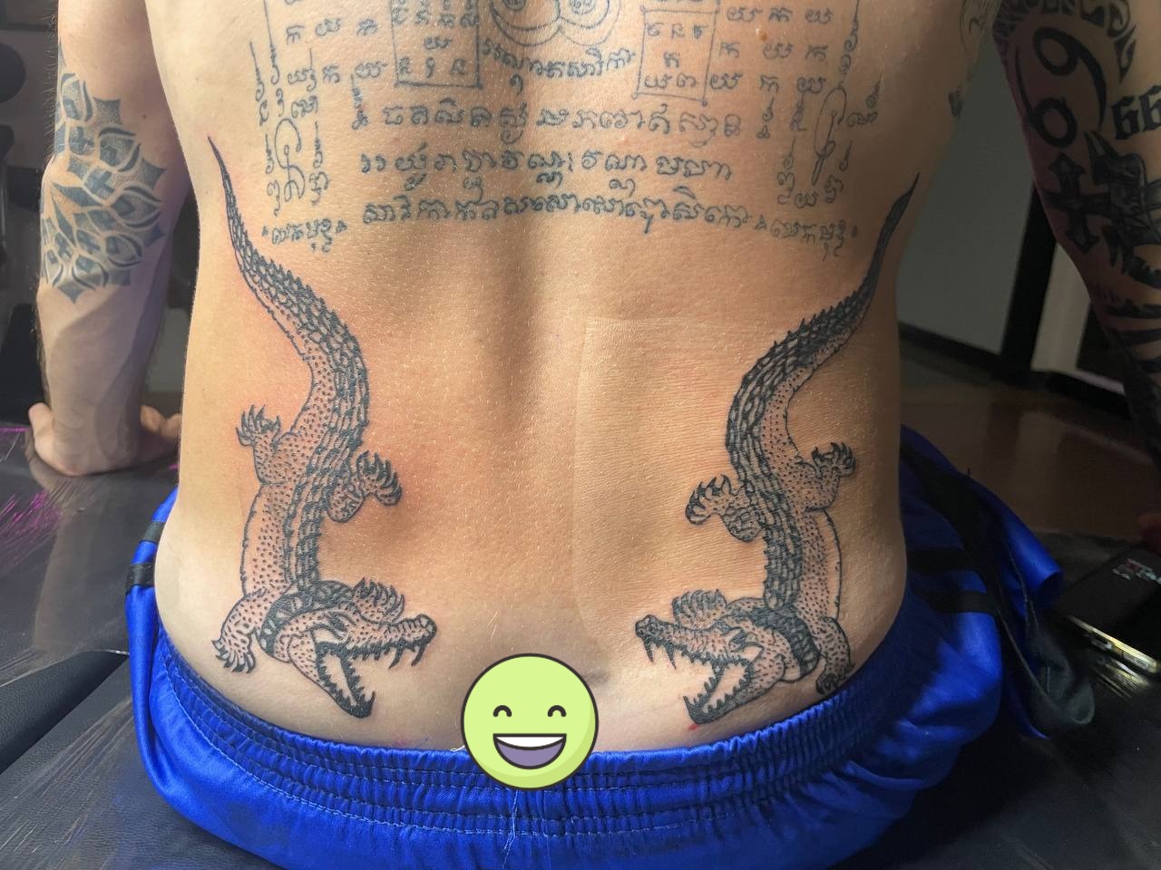 Back piece with symmetrical crocodiles and Khmer script
