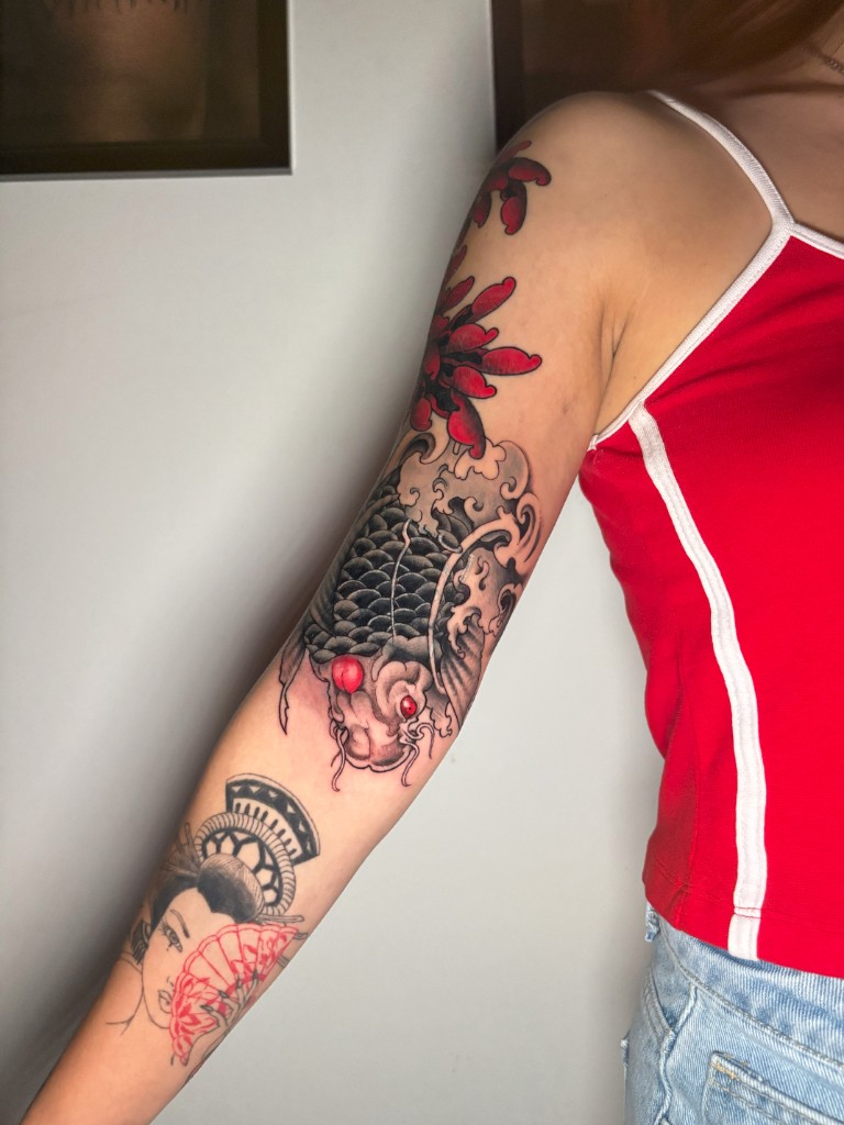 Japanese traditional sleeve — koi, waves, and portrait