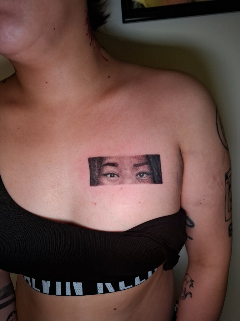 Black and grey realism — eyes on chest